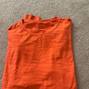 Orange lululemon cropped long sleeve